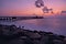 Sunrise in beach long exposure middle of bridge