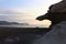 Sunrise on the beach and rock silhouettes