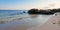 sunrise on the beach. rocks on the sandy shore