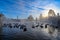 sunrise behind mallard birds in pond in park