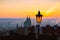 Sunrise behind an old street lamp over Lesser Town, Prague, Czech Republic