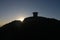 Sunrise behind the worcestershire beacon Toposcope. Wide perspective