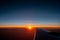 A Sunrise bellow The Wing of an Airplain