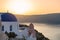 Sunrise at blue domed churches on Santorini Greek Island,