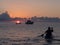 Sunrise and boat in mediterranean sea. Pantelleria Island, Italy