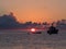 Sunrise and boat in mediterranean sea. Pantelleria Island, Italy