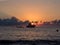 Sunrise and boat in mediterranean sea. Pantelleria Island, Italy