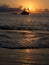 Sunrise and boat in mediterranean sea. Pantelleria Island, Italy