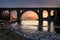 Sunrise in a bridge over the a beach