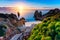 Sunrise at Camilo beach in Lagos, Algarve, Portugal. Wooden footbridge to the beach Praia do Camilo, Portugal. Picturesque view of