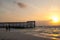 sunrise cancun pier beach waves ocean sea water clouds sun reflection