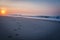 Sunrise on Cape May Beach with Dog Footprints