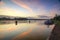 Sunrise at channel nimy-peronnes in belgium with barge waiting  in front of the lock