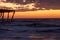 Sunrise and The damaged fishing pier on Pawley\\\'s Island, South Carolina