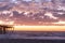 Sunrise and The damaged fishing pier on Pawley\\\'s Island, South Carolina