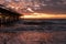 Sunrise and The damaged fishing pier on Pawley\\\'s Island, South Carolina