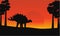 At sunrise dinosaur stegosaurus scenery
