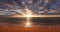 Sunrise with dramatic cloudscape and sea beach. Ocean sunset.