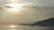 Sunrise early in the morning on the tropical Pemuteran Bali beach, Indonesia,fishing boat floats on a bay