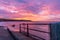 Sunrise at Filey fishing jetty looking towards Filey Brigg, Yorkshire, UK