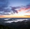 Sunrise. Foggy morning. Scenery with high mountains. Orange sky. Forest. Wild Carpatian touristic place. Natural landscape