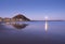 Sunrise with full moon over the Zurriola beach, city of Donostia-San Sebastian, Basque Country