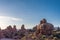 Sunrise with giant red rock formations inside of Utahs Arches National Park