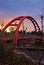 Sunrise Glowing Over A City Bridge