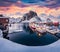 Sunrise on Hamnoy port with Festhaeltinden mount on background, Norway, Europe