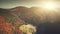 Sunrise high mountain forest slope aerial view