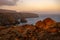 Sunrise highlights rocks on the cliffs of Santa Cruz Island