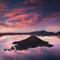 Sunrise at Hillman Peak, Crater Lake National Park with summer scene. Panoramic view of the deepest lake in USA.