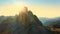 Sunrise illuminates mountainous terrain, showcasing majestic Three Peaks of Lavaredo and sand-covered foothills in Alps