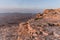 Sunrise in Israel dry negev desert. Amazing view on mountaines, rocks and sky. National park makhtesh ramon