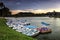 Sunrise on lake with lake boat as foreground