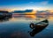 Sunrise on Lake Seliger with an old boat in the foreground.