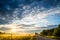 Sunrise landscape of sky, road and field