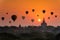 Sunrise many hot air balloon in Bagan, Myanmar. Bagan is an ancient with many pagoda of historic buddhist temples and stupas. The