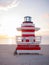 Sunrise in Miami Beach Florida, with a colorful lifeguard house in a typical Art Deco architecture, at sunrise with ocean and sky