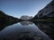 Sunrise mirror reflection of Zugspitze mountain massif in clear calm alpine lake Seebensee in Ehrwald Tyrol Austria alps