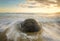 Sunrise at Moeraki Boulder beach New Zealand.