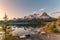 Sunrise on Mount Rundle with colorful sky reflection on Rundle Forebay reservoir in autumn at Canmore