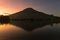 Sunrise with Mount Sumbing with lake surface on the foreground