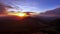 Sunrise in the mountains,clouds spill over the peaks of hills in the Carpathian.Panorama, timelapse