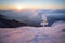 Sunrise in mountains, orientation signs in foreground