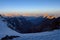 Sunrise in mountains. Reflection of red sun on mountain snow peaks, pass Mirali, 5300, Fann, Pamir Alay, Tajikistan