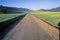 Sunrise on a mustard field and spring road in Ojai, California