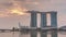 Sunrise near Marina Bay Sands Hotel dominates the skyline at Marina Bay in Singapore time lapse.