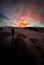 Sunrise near Yellowstone geysers with steam and silhouette of pe