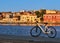 Sunrise in Old Venetian port, Chania, Crete, Greece. Pier, bicycle, quayside, Maritime museum. Bike rides, cycling